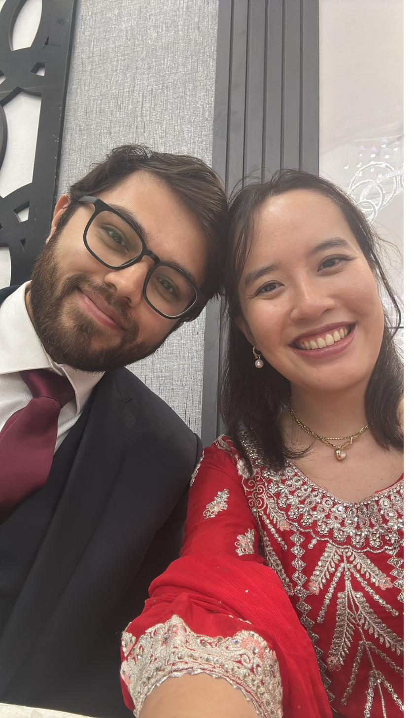 Selfie of the couple in Indian formal wear, Jocelyn in a red suit